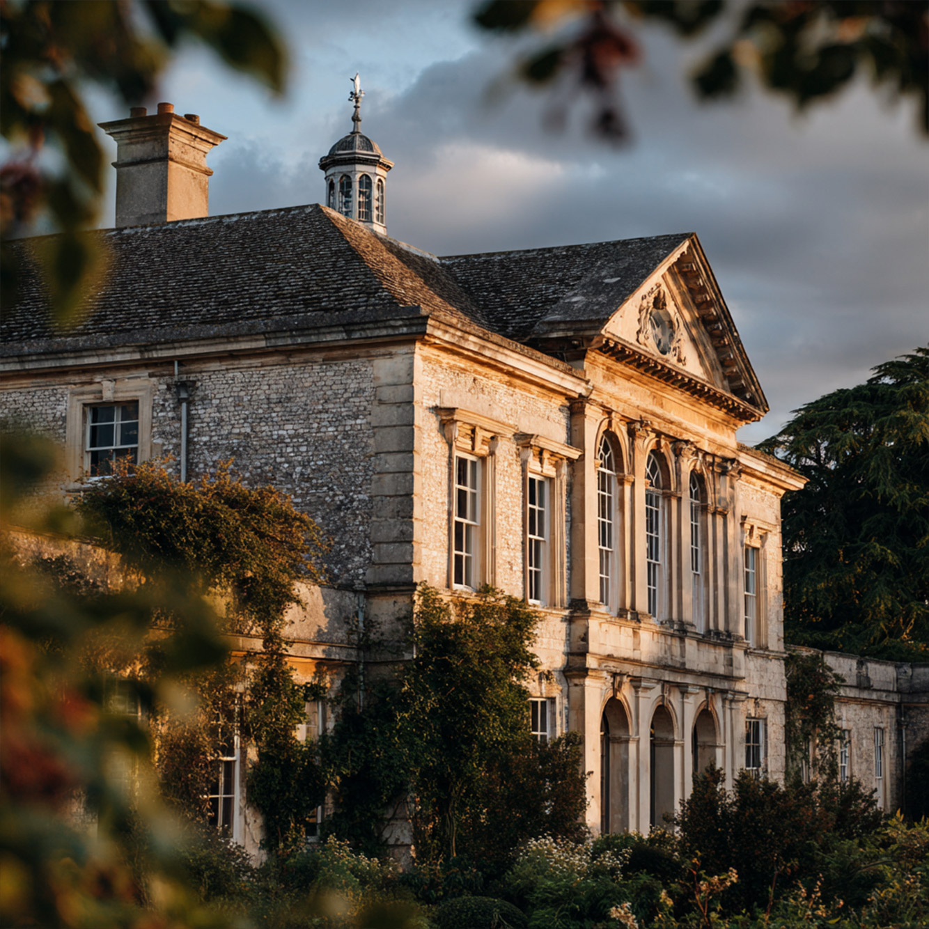 Through the trees stately home