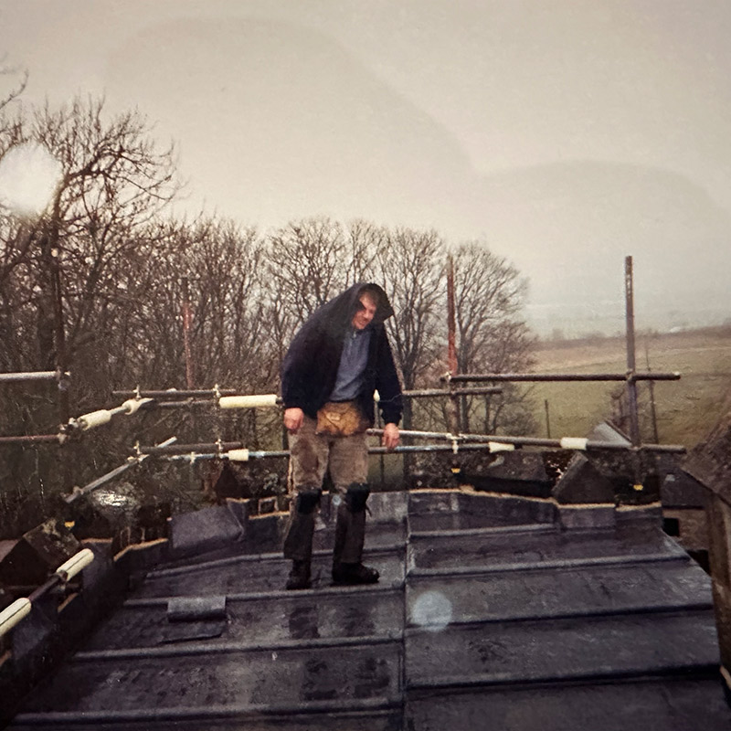 Lumley 1997 Person using jacket to hide from the rain on a roof