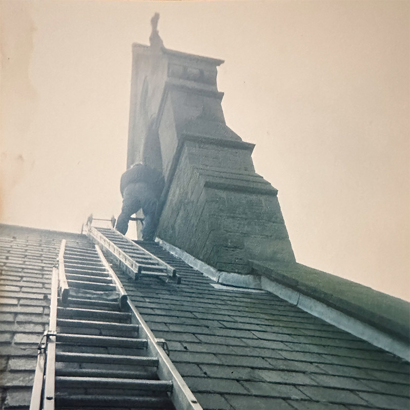 Lumley 1992 Person using a ladder to repair a roof
