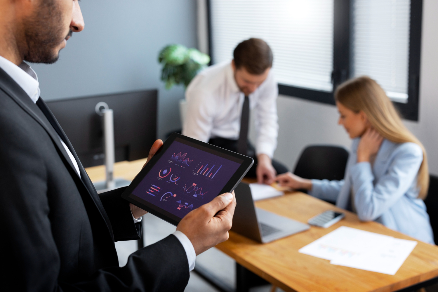 a man holding a tablet