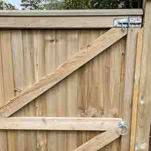 Framed ledged pedestrian gate with brenton bolt and cross brace for strength.