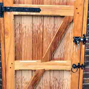 Softwood pedestrian gate with diagonal bracing and galvanised fittings.