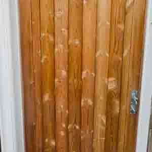 Vertical T&G pedestrian gate with galvanised handle and weather capping.