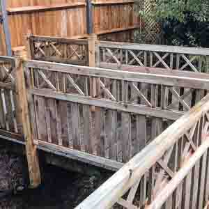 Timber panel fencing alongside decking area, creating a natural outdoor enclosure.