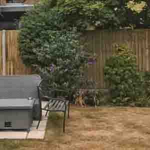 Timber panel fencing enclosing a patio with gravel boards and clean straight lines.