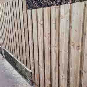 Close-up of vertical palisade boards showing clean timber finish and spacing.