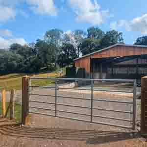 Steel field gate installed to secure farm entrances and livestock paddocks.