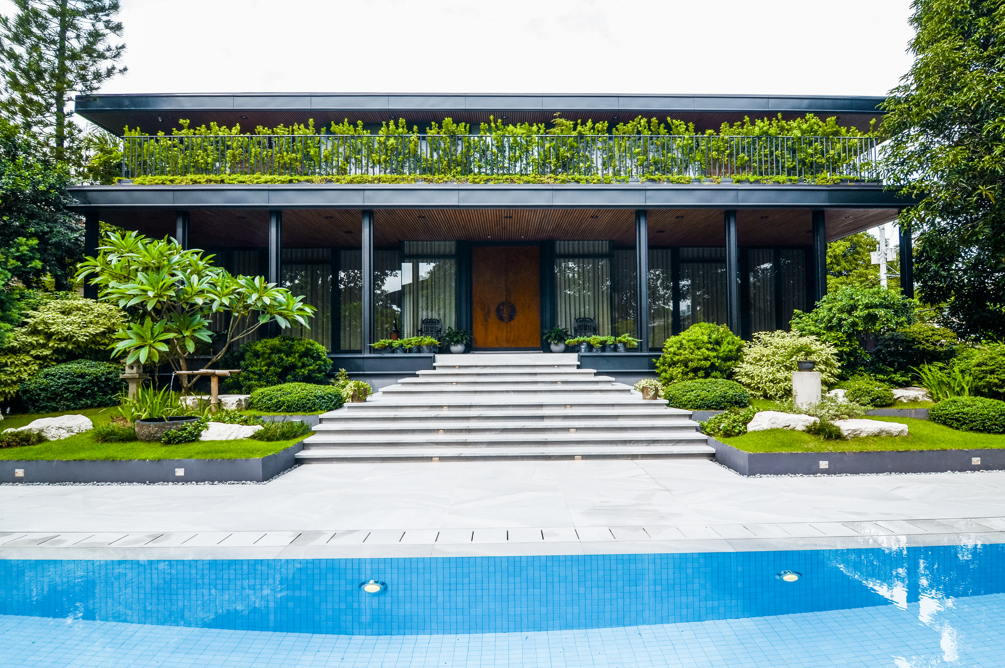 Japanese Chic — The Siao Residence exhibits a balance and harmonious blend of the landscape's natural elements and its modern architectural house that invites guests and homeowners to relax and enjoy their outdoor space