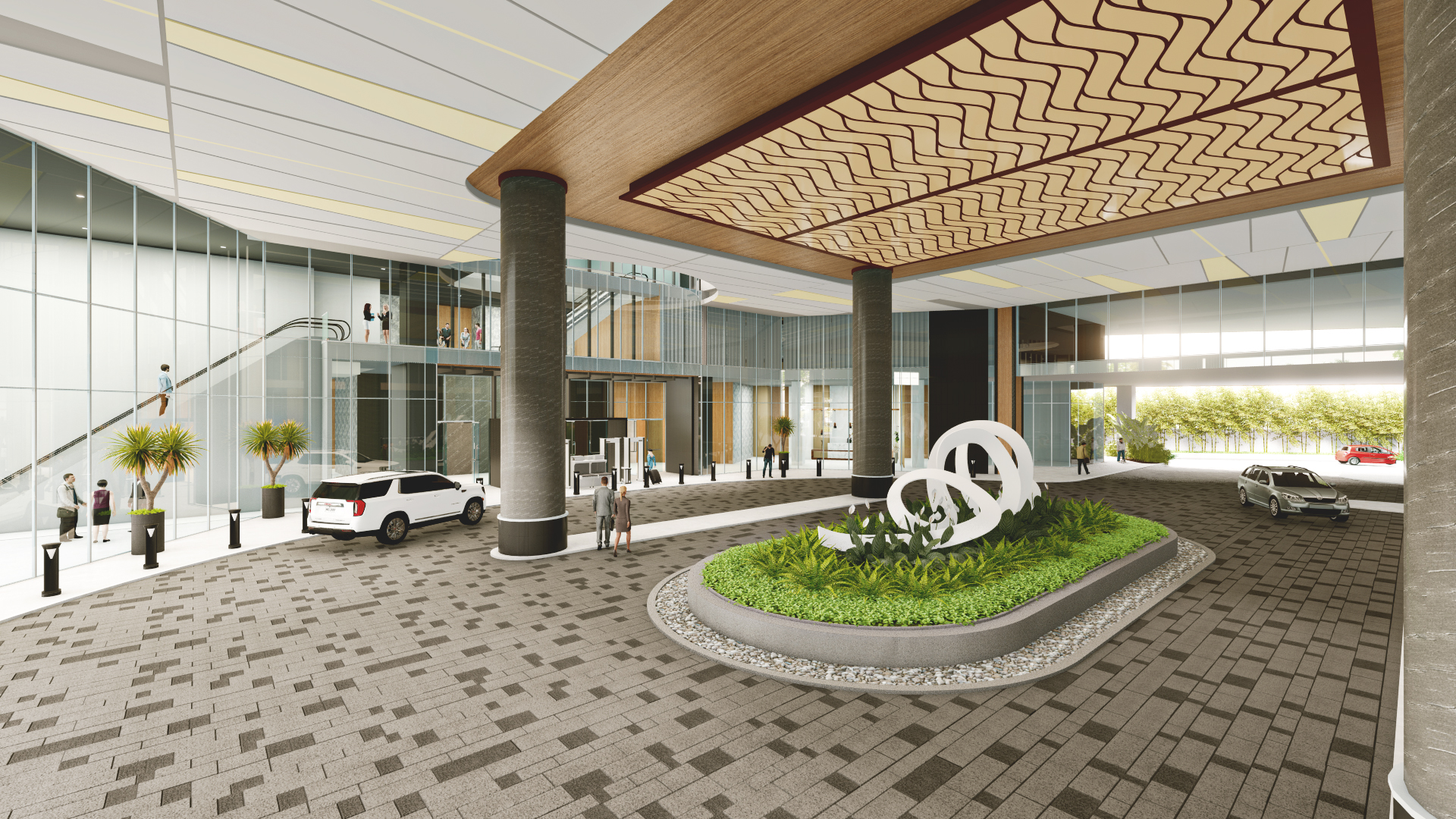 The hotel entrance features a grand, covered driveway area out of patterned stone tiles, a ceiling with wood panels, and a circular planting isle with an abstract sculpture.