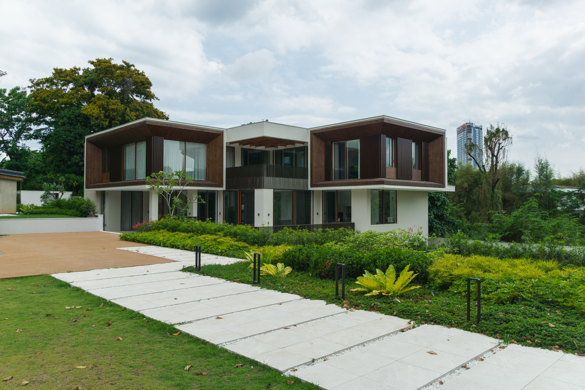 Casas La Vista — Multi-layered planting frame expansive lawns and pathways to provide family and friends a mixture of intimate and open spaces to relax and enjoy