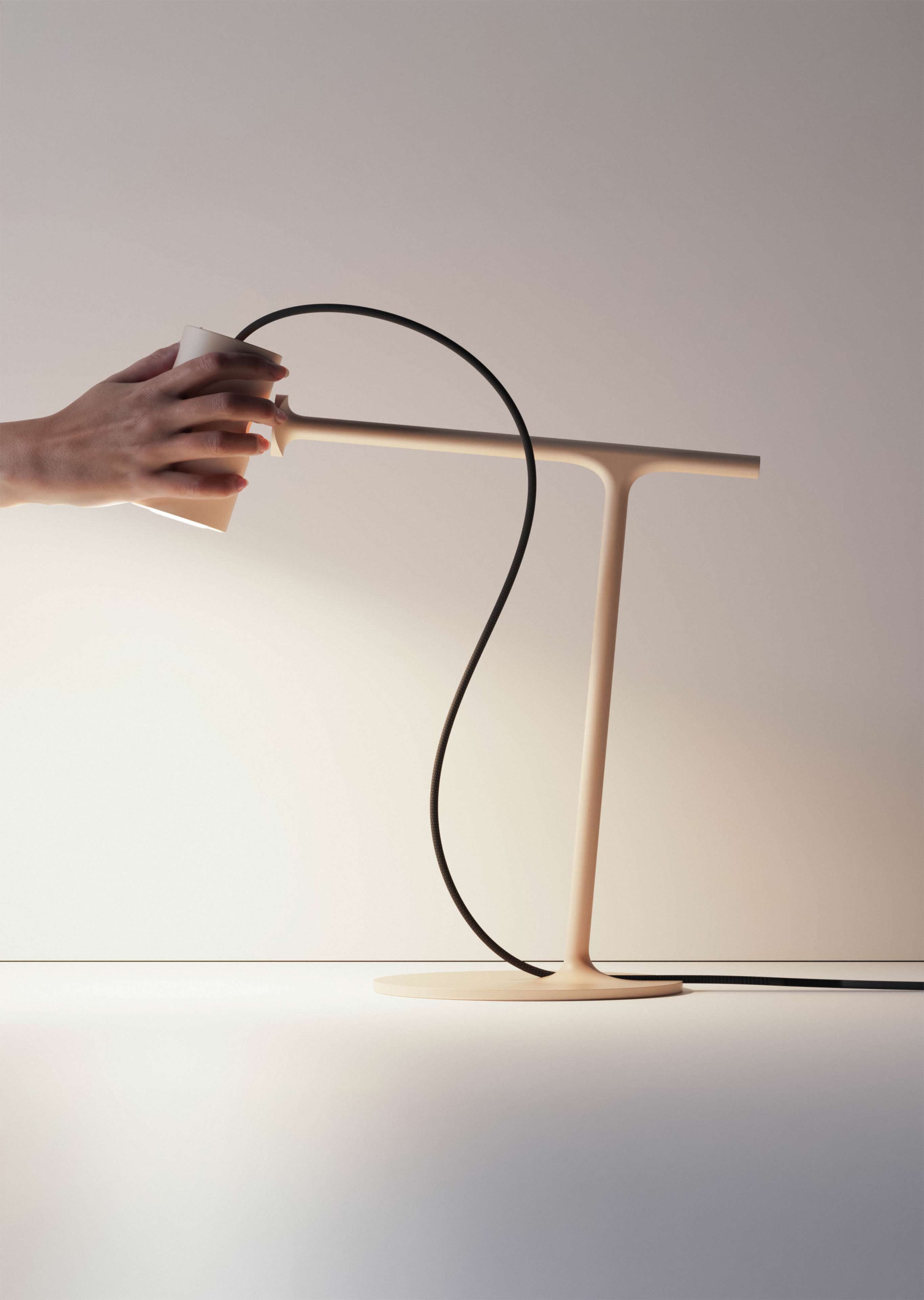 Person Detaching Grab Lamp from the Stand