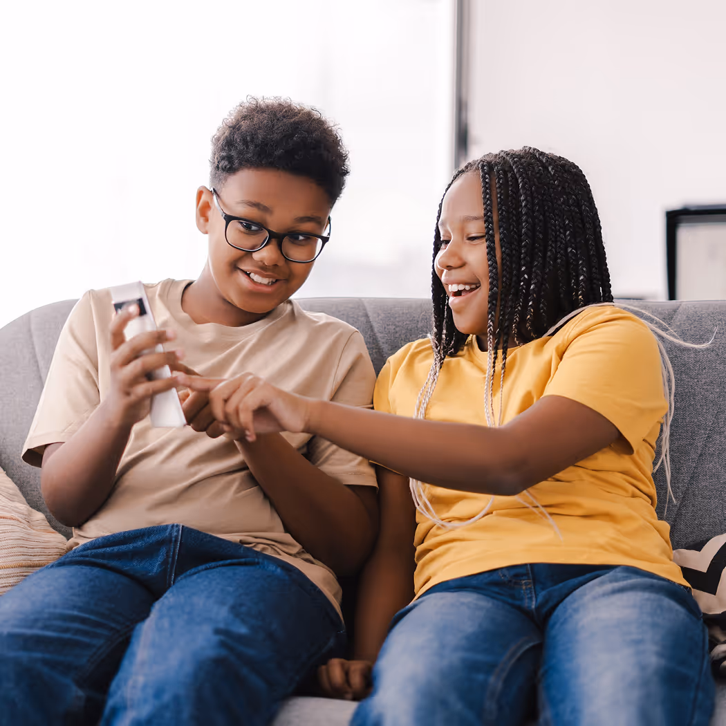 Kids exploring student rewards card education app on phone.