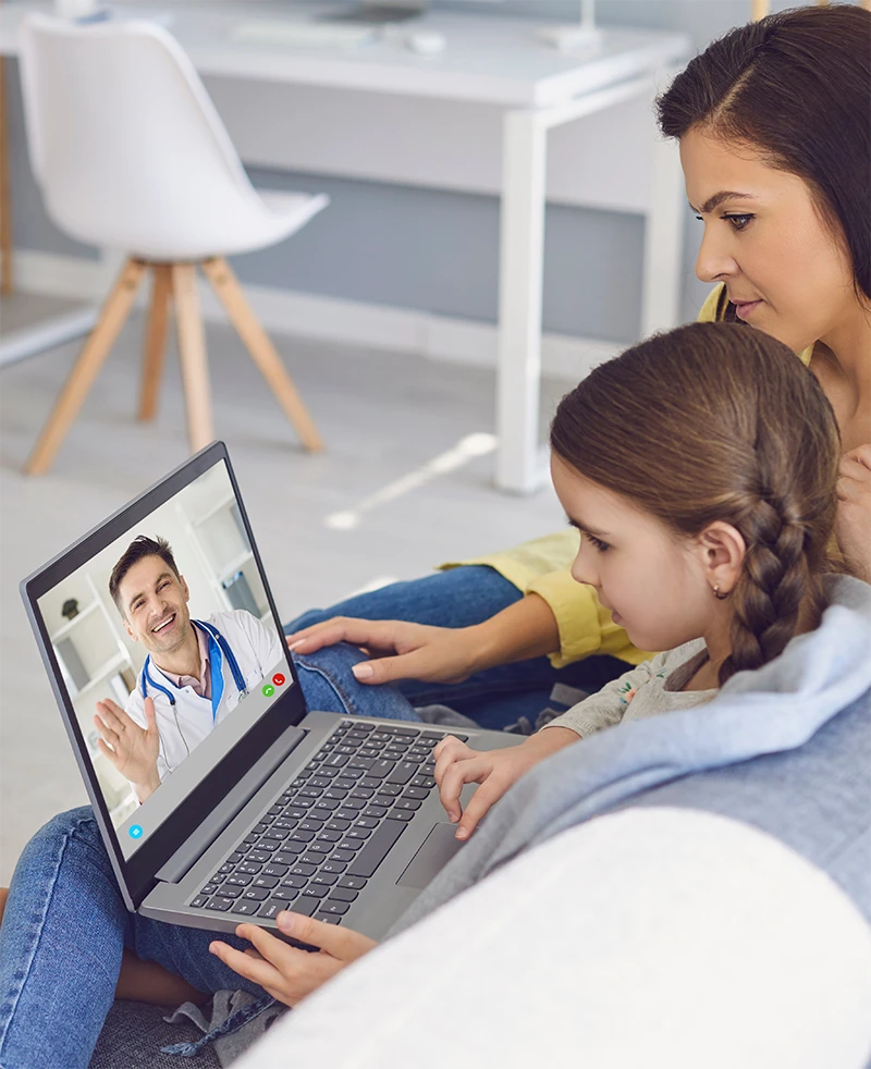 Mother and daughter talking with a doctor using Laptop