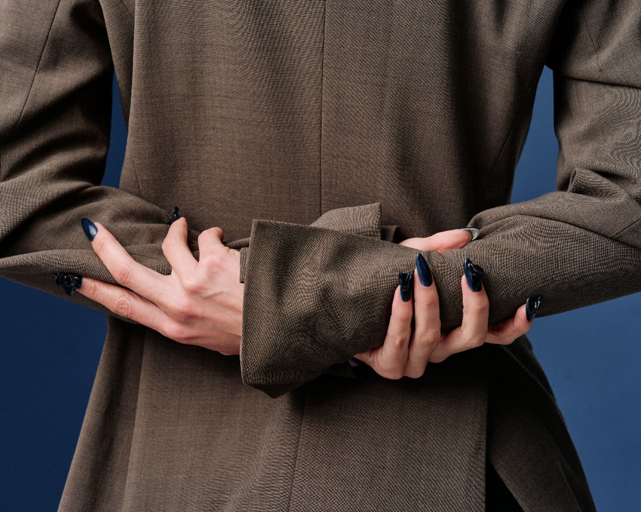 woman holding arms behind her back 