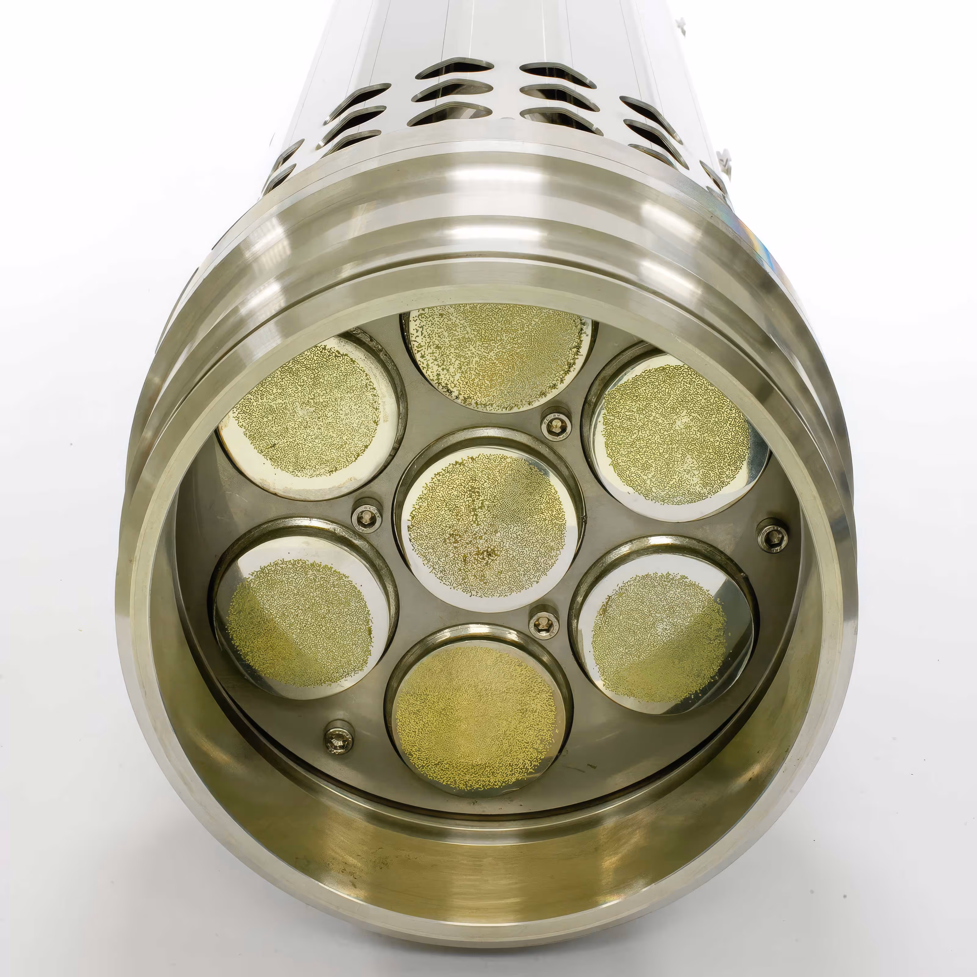 Cylindrical metallic housing with multiple circular inlays — HEGGEMANN precision component for energy or industrial system applications.