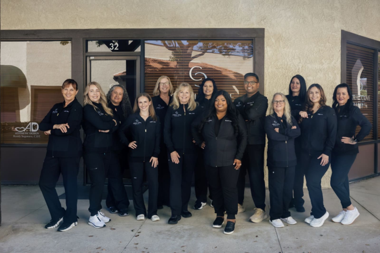 Coral Cove Dental team members posing together in professional attire