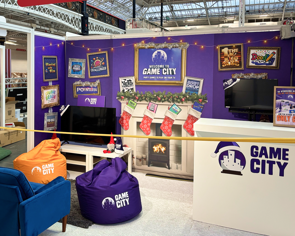 Game.City branded exhibition stand with TV quiz game displays