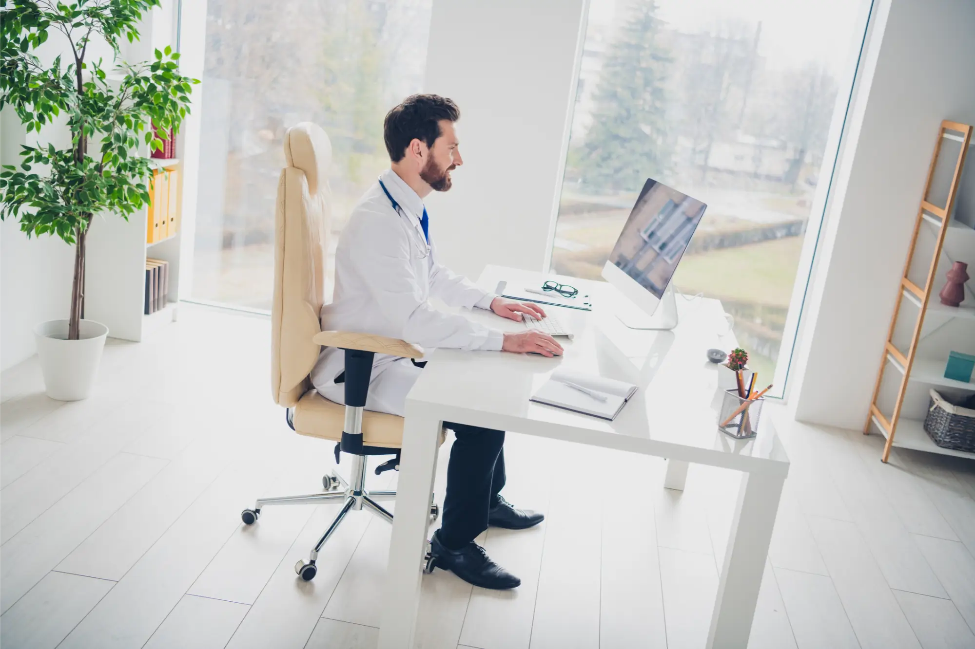 Doctor sitting at computer