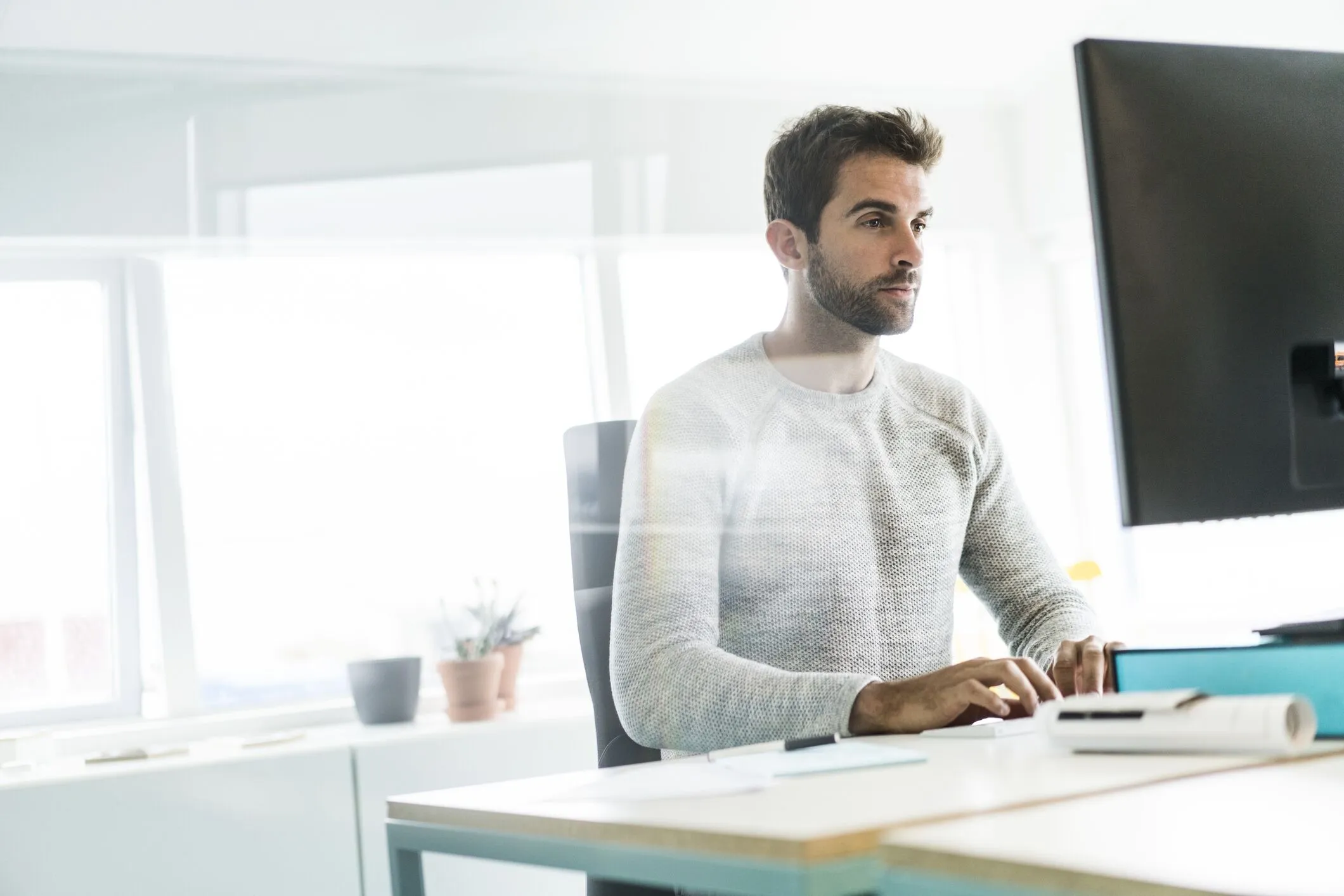 Claims professional using a computer to review risk and claims information