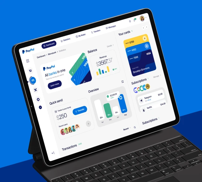 Online bank dashboard displayed on a tablet screen connected to a Magic Keyboard