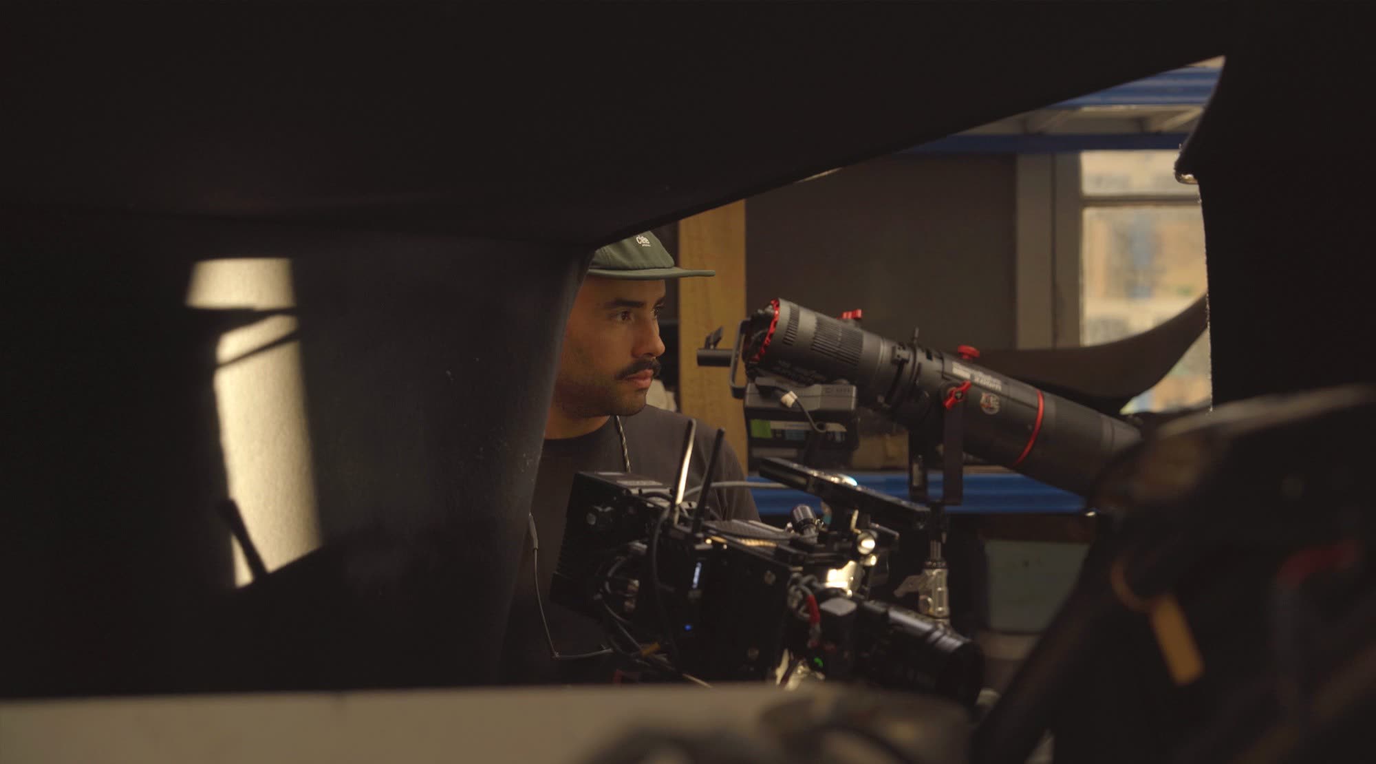 Camera operator filming in a workshop