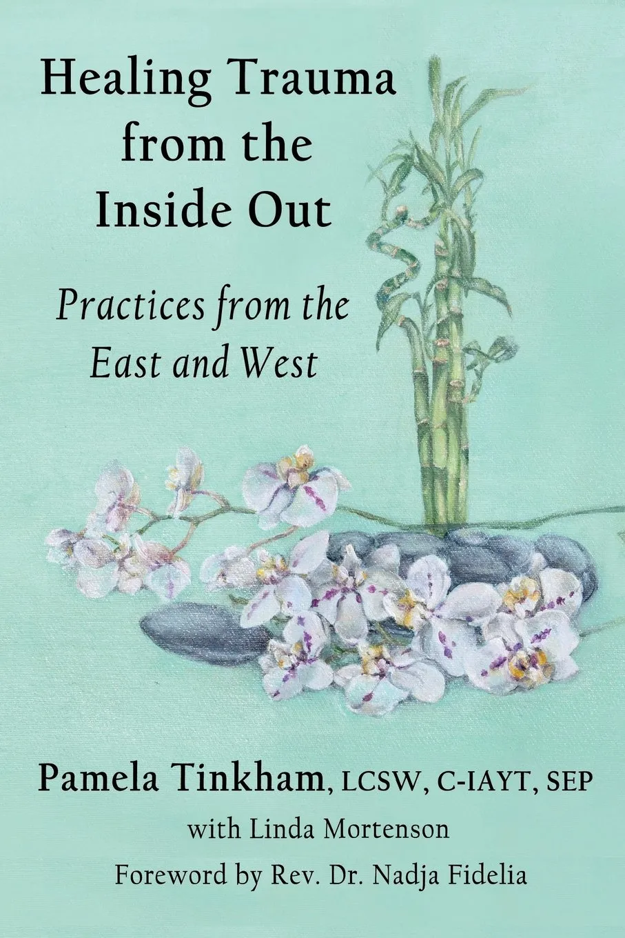Book cover titled 'Healing Trauma from the Inside Out: Practices from the East and West' by Pamela Tinkham with Linda Mortenson, featuring a light blue background with bamboo stalks, white orchids, and smooth black stones.