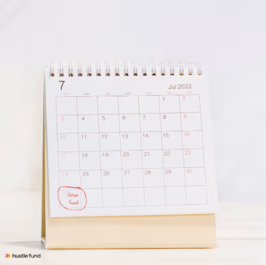 Desk calendar showing July 2022 with a handwritten note circled on the 31st that says 'close fund'.