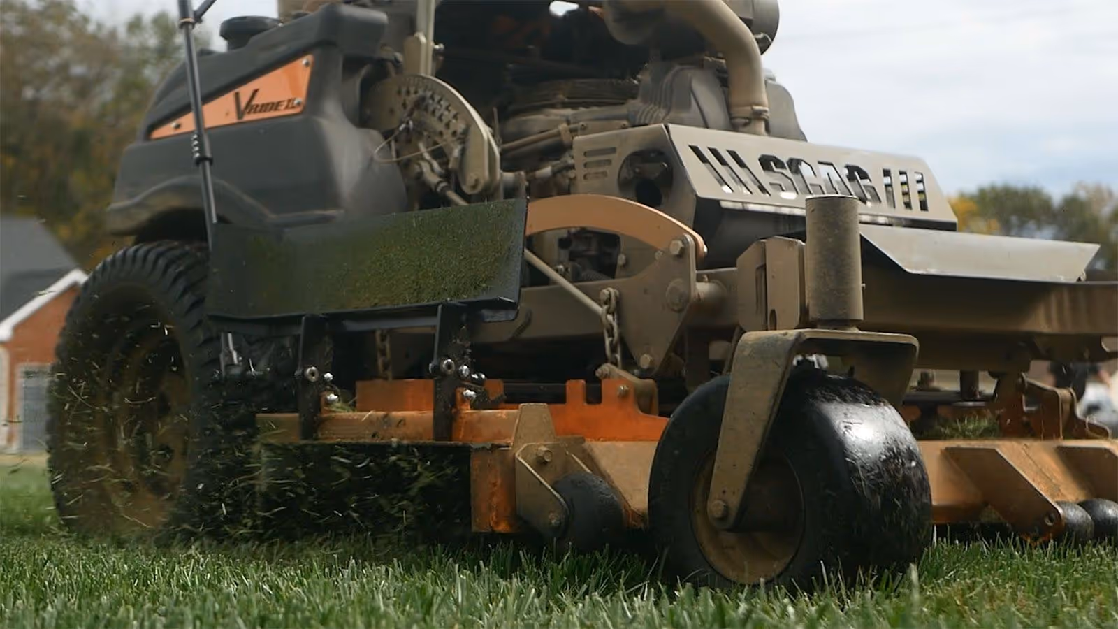 Professional mower cutting residential lawn for Flemings Detailed Lawn Care in Dickson County Tennessee