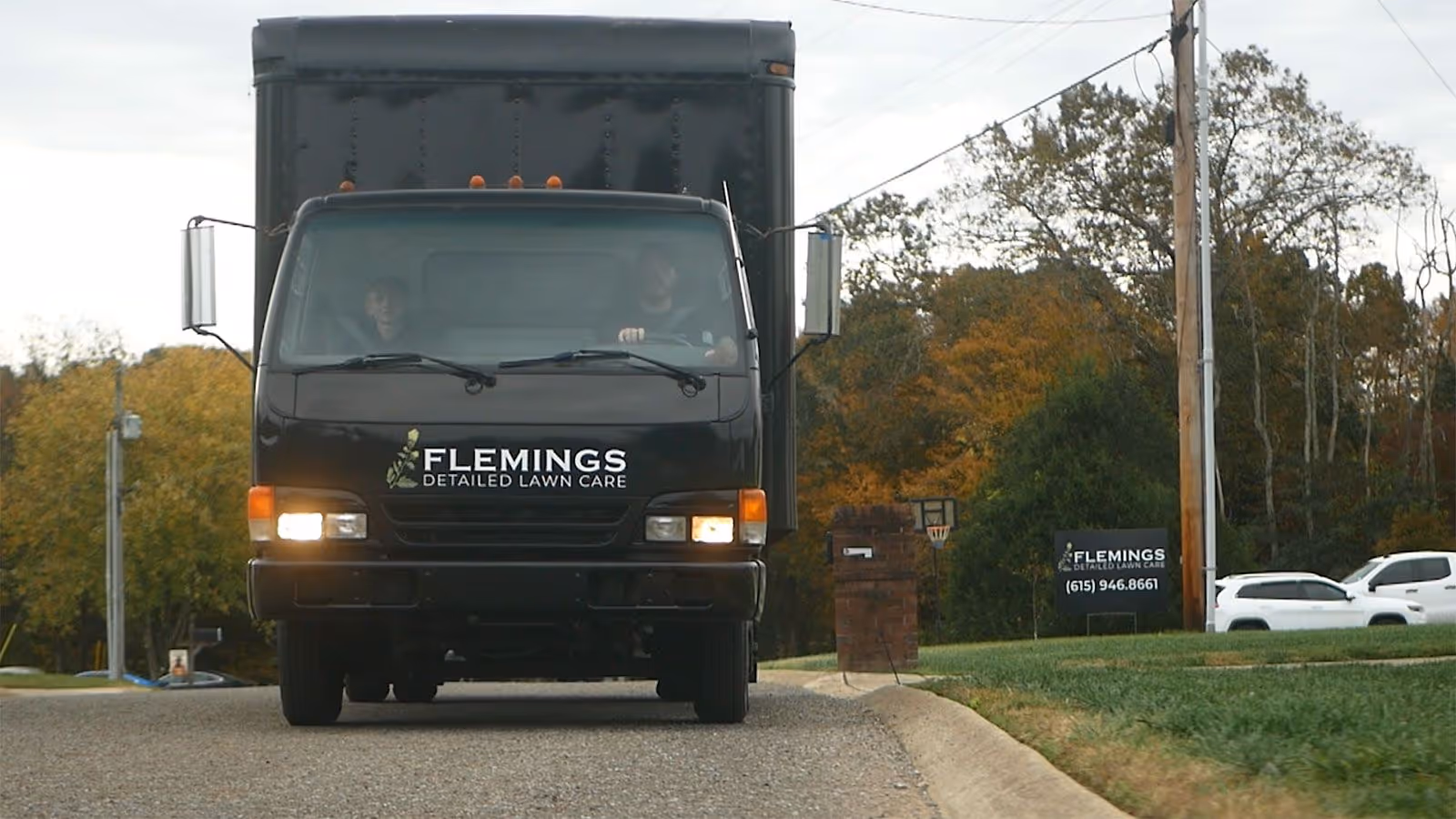 Branded Flemings Detailed Lawn Care service truck near me ready for lawn maintenance