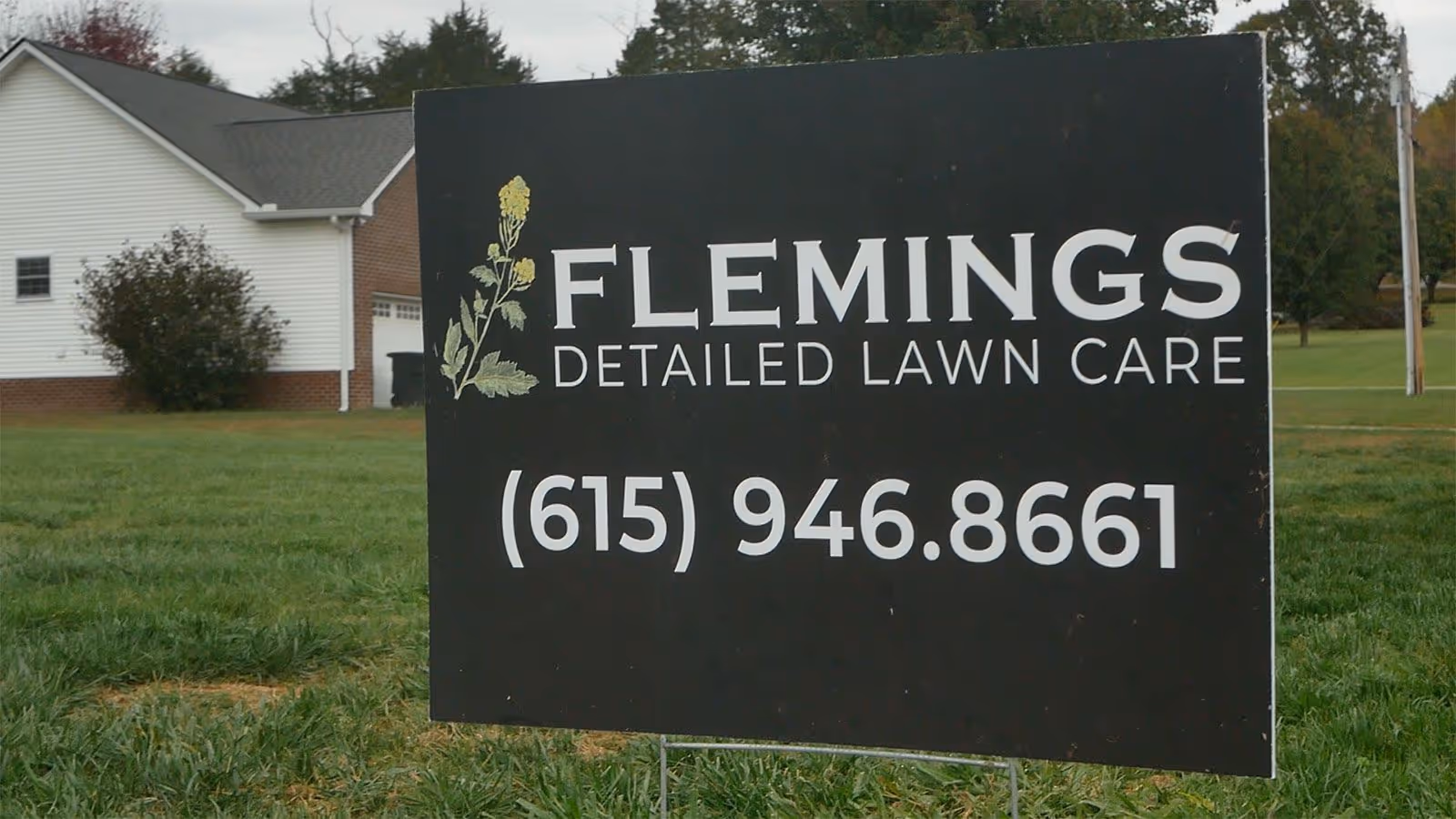 Flemings Detailed Lawn Care yard sign promoting professional lawn and landscaping services in Dickson County Tennessee