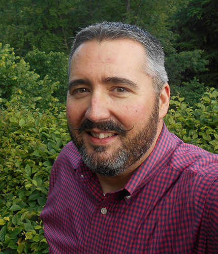 headshot of smiling business owner