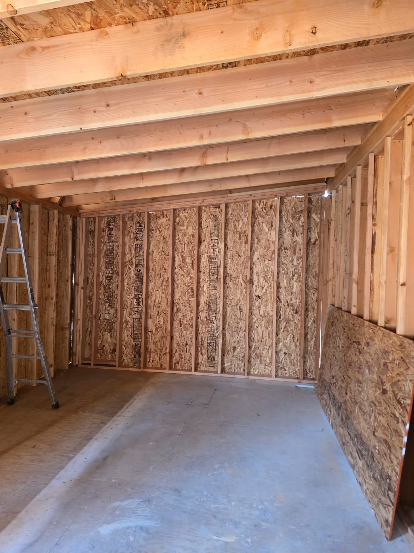 A room that has a ladder in it.