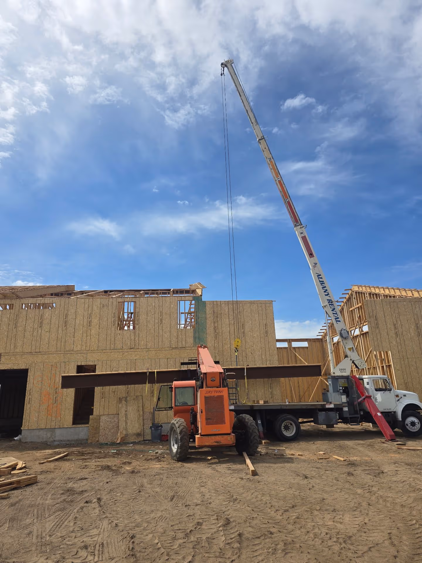 A crane is lifting a building into place.
