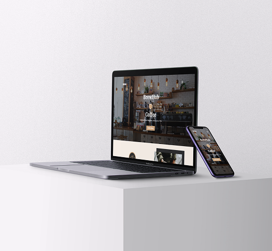 iphone 11 and macbook on top of a stand