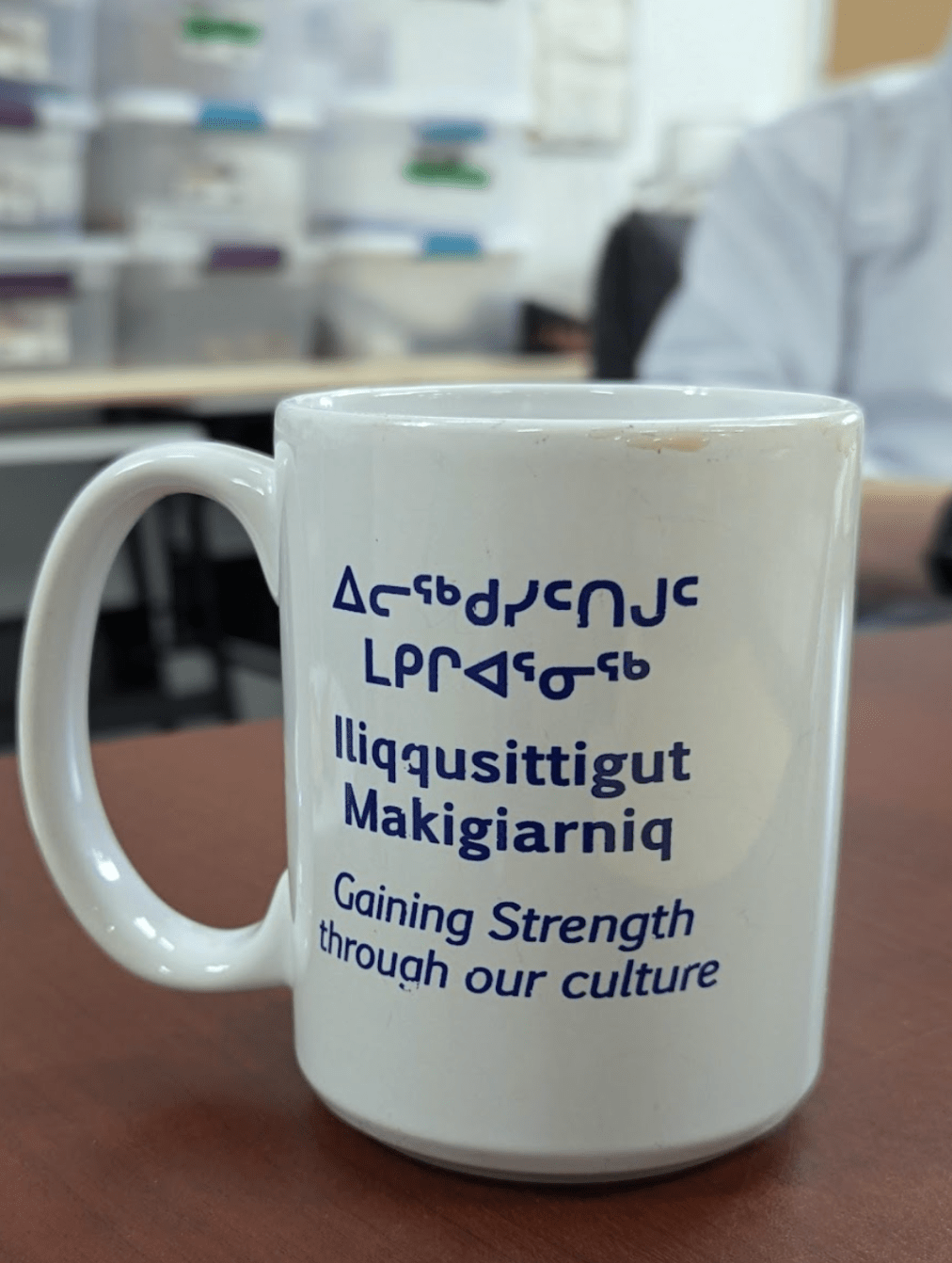 A mug that reads "Gaining strength through culture"