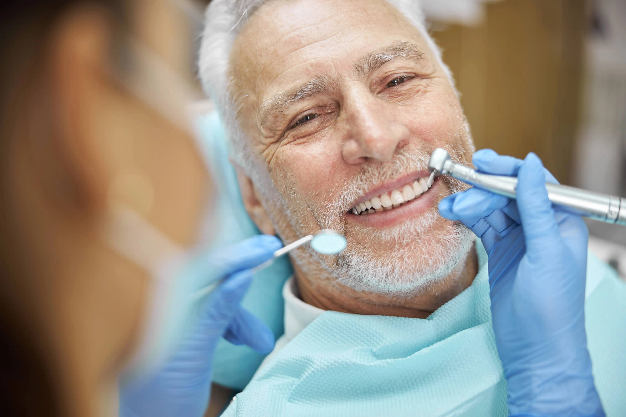 Senior man smiling with dentist 33458