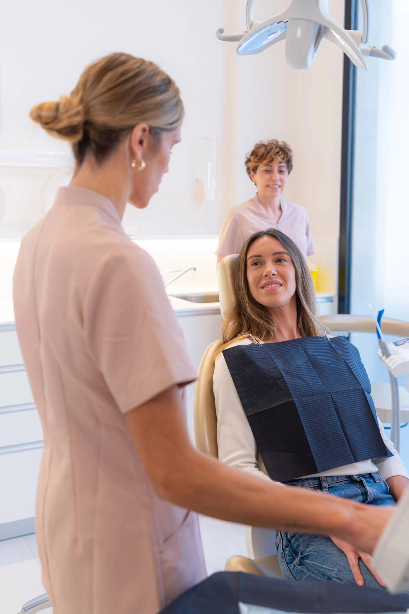 Woman talking to a sleep apnea dentist Jupiter
