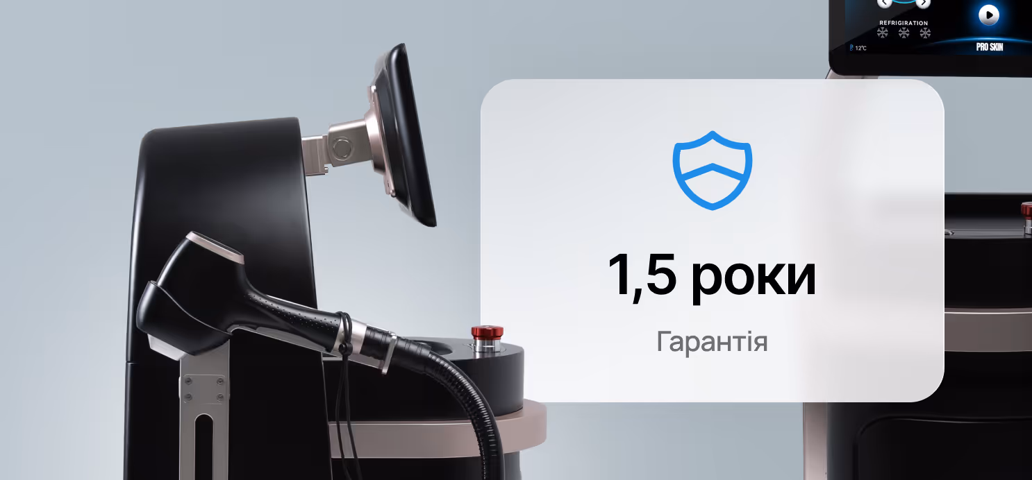 Close-up of a black medical or cosmetic device with a handpiece and a display showing a shield icon and text in Ukrainian about a 1.5-year warranty.