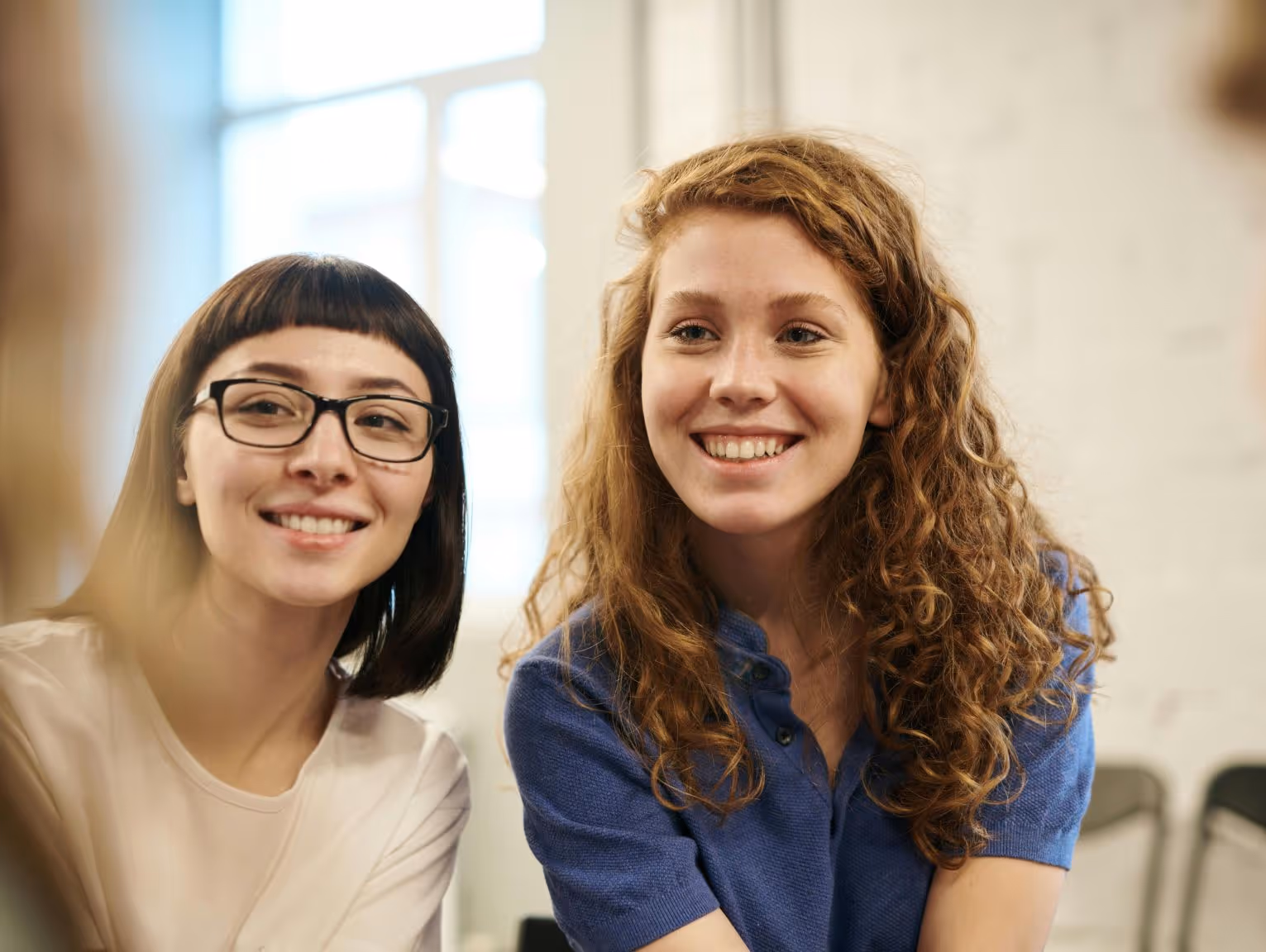 Two young women undergoing gender dysphoria evaluation and support.