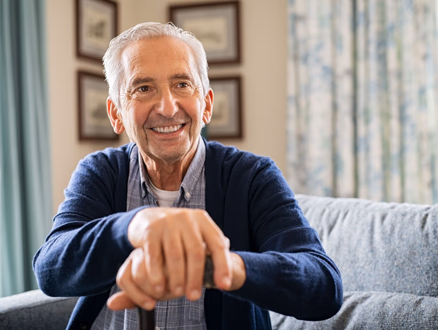 Smiling elderly man with white hair receiving tailored treatment plan for complex mood disorder.