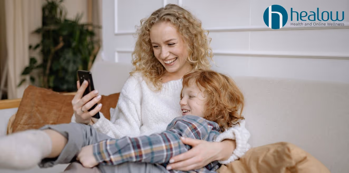 Woman in San Jose, CA on couch with child, using therapy to reduce conflict, improve communication, and support growth.