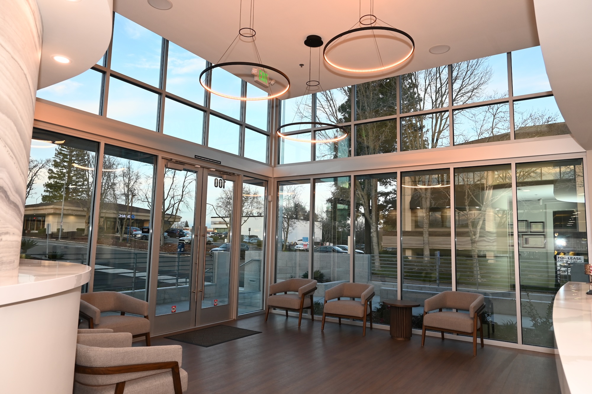 Modern lobby design with large windows and stylish chandeliers in Roseville, CA.