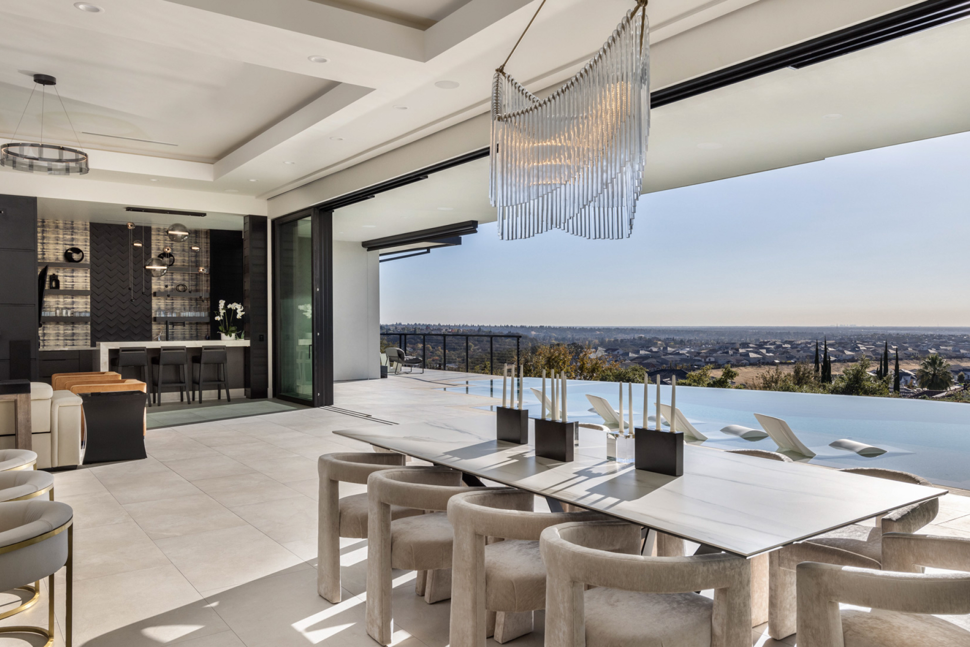 Luxury dining room featuring a modern table and unique chairs, with a breathtaking view in Lincoln, CA.