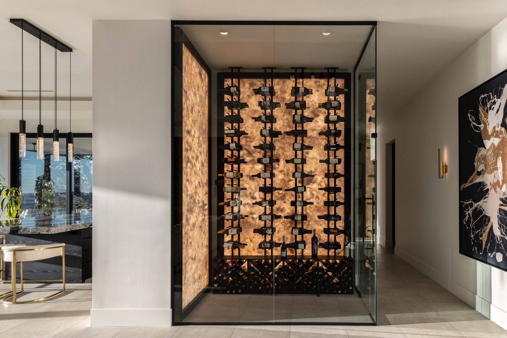 Modern wine storage area featuring a glass display and illuminated backdrop in Lincoln, CA