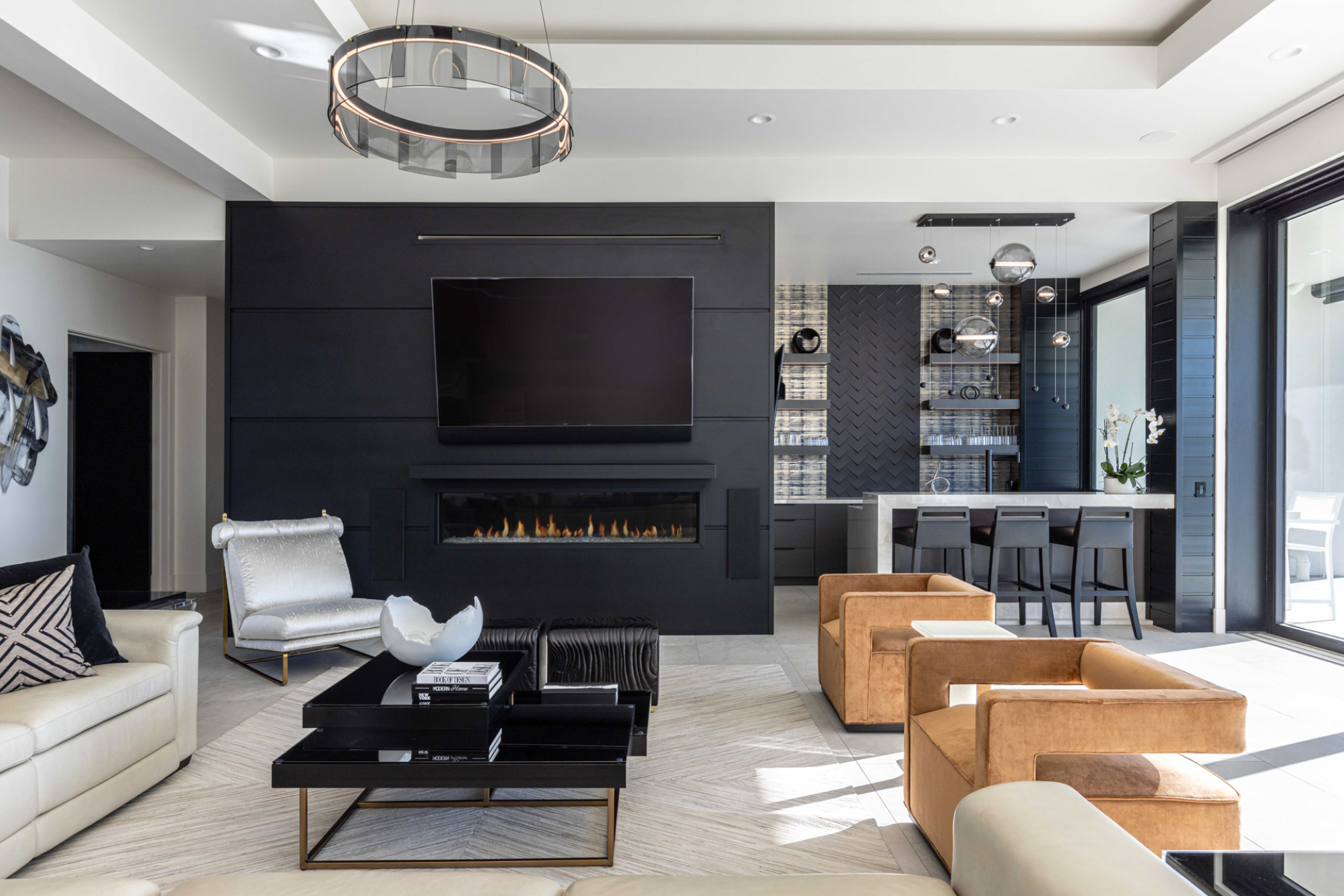 Modern living room featuring a sleek fireplace, black accent wall, and stylish seating in Lincoln, CA.