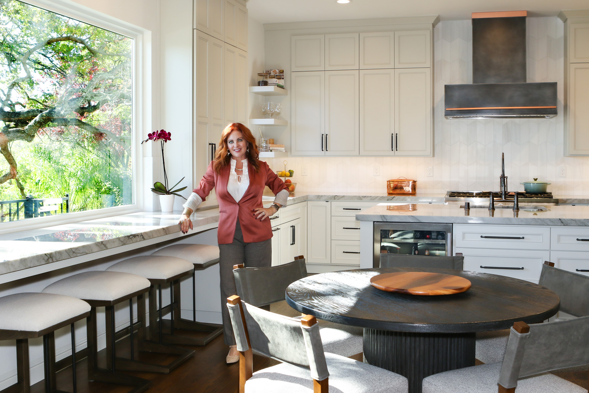 Modern kitchen remodel in Roseville, CA featuring a spacious island with marble countertop and contemporary cabinetry.