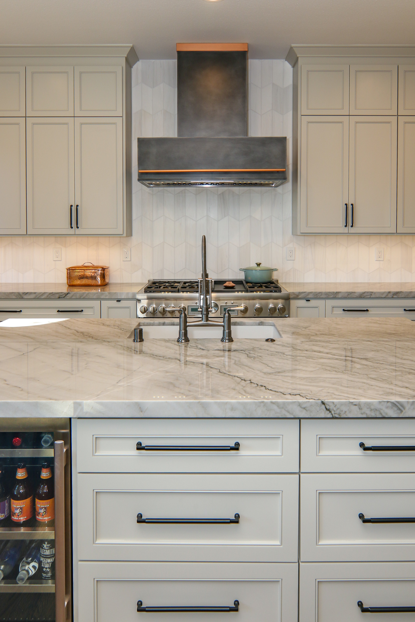 Modern kitchen remodel in Roseville, CA featuring marble countertops and stylish cabinetry.