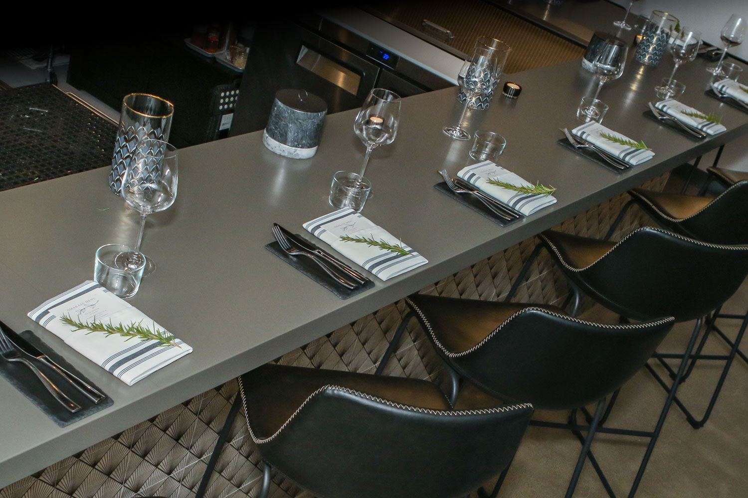 Modern bar seating with elegant glassware and stylish dining setup in Lincoln, CA.