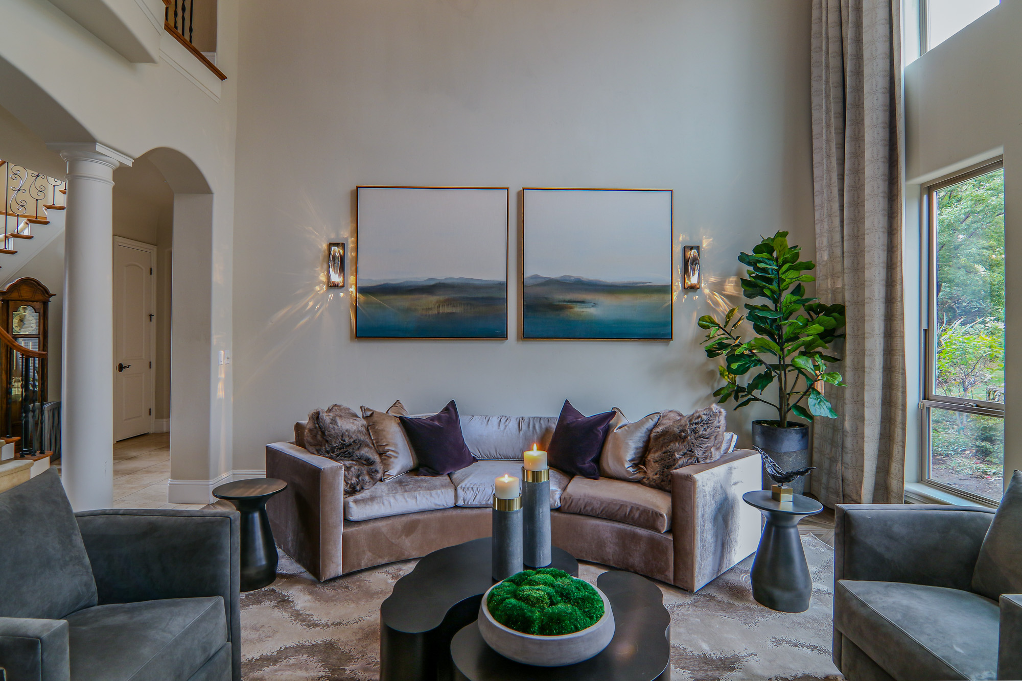 Stylish living room in Lincoln, CA featuring modern furniture, elegant art, and greenery.