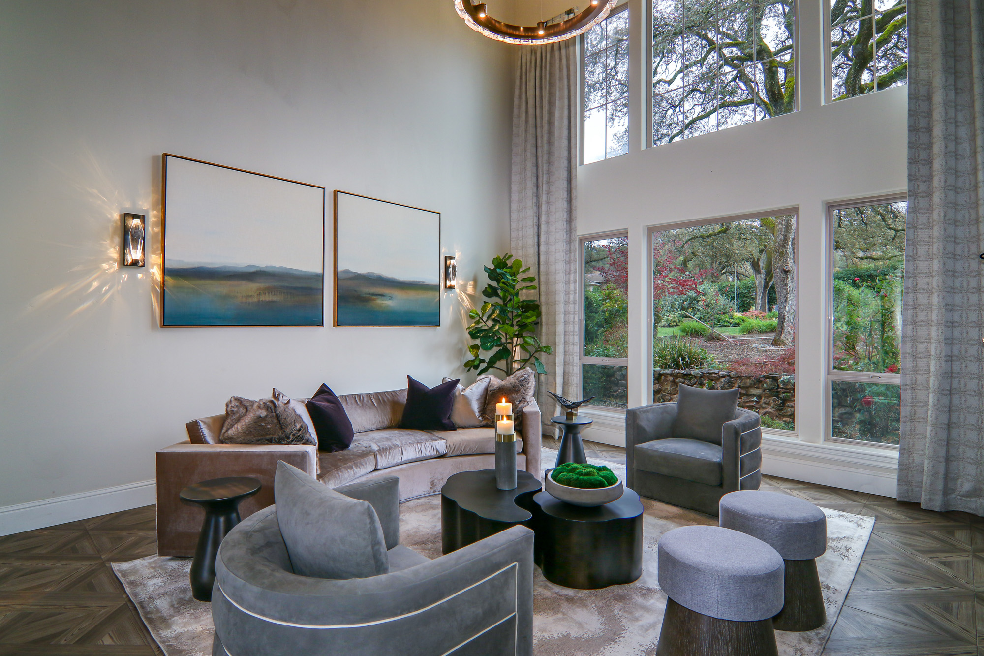 Modern living room in Lincoln, CA featuring large windows, stylish furniture, and contemporary art.